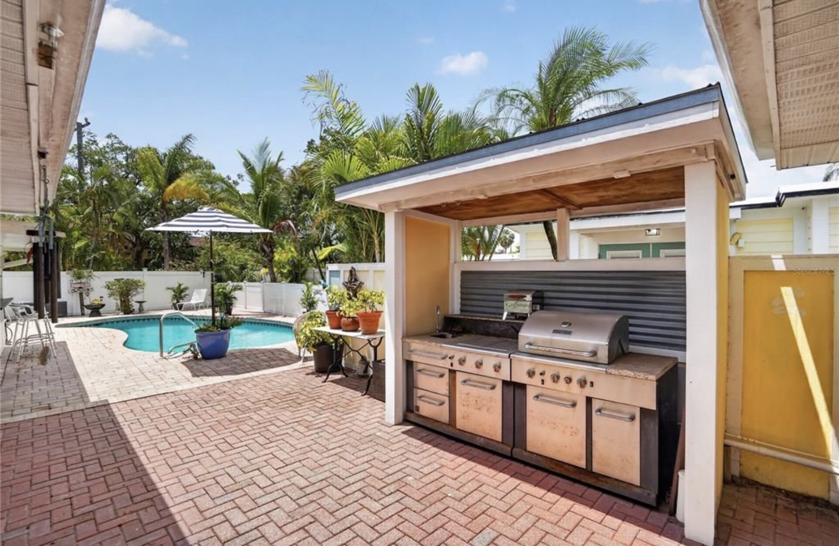 Outdoor kitchen beside the pool